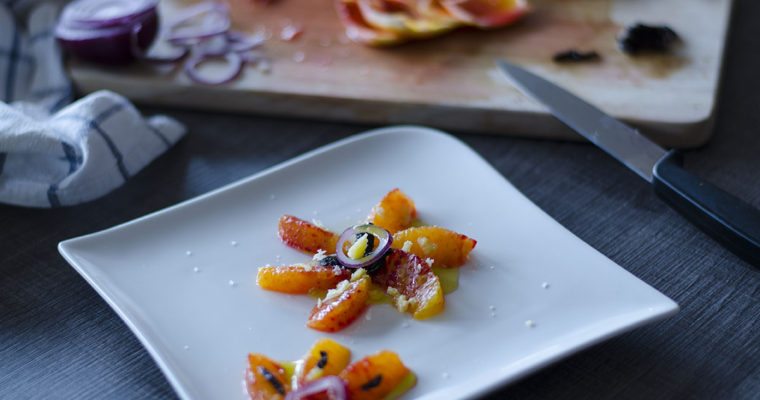 Orange, red onion, olives and cheese salad
