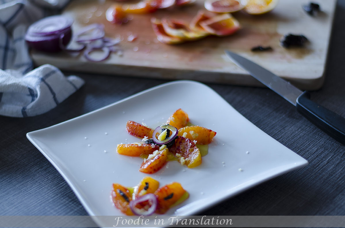 Orange, red onion, olives and cheese salad